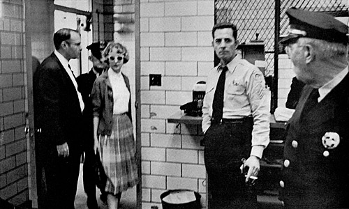 Margaret Leonard being arrested for sitting in a Negro lunch counter.